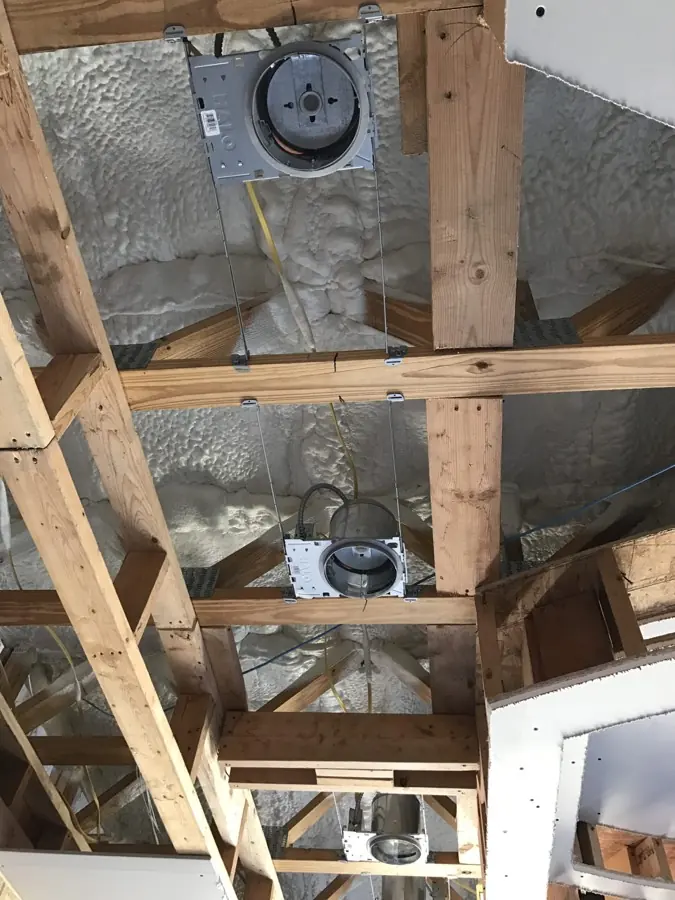 Attic space in a South Texas home with spray foam applied along the roof deck