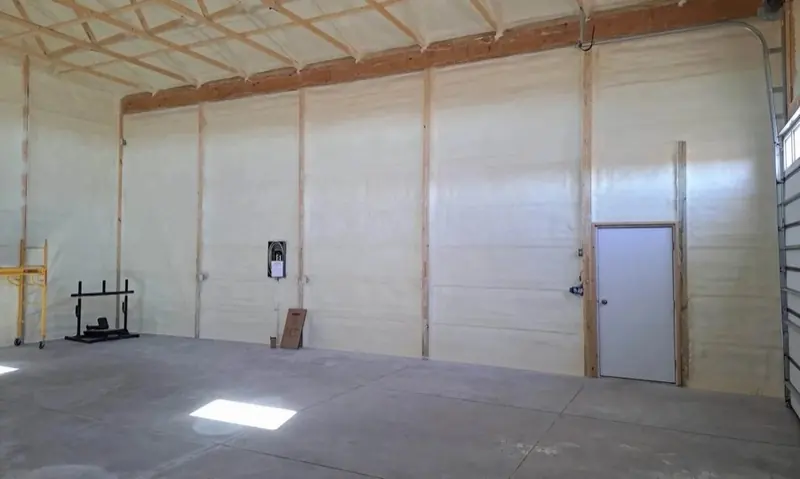 Finished interior of a metal building insulated with spray foam