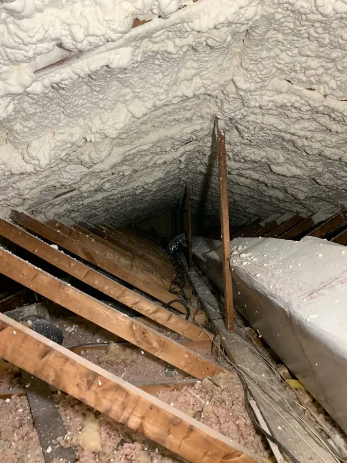 Attic roofline fully encapsulated with spray foam insulation